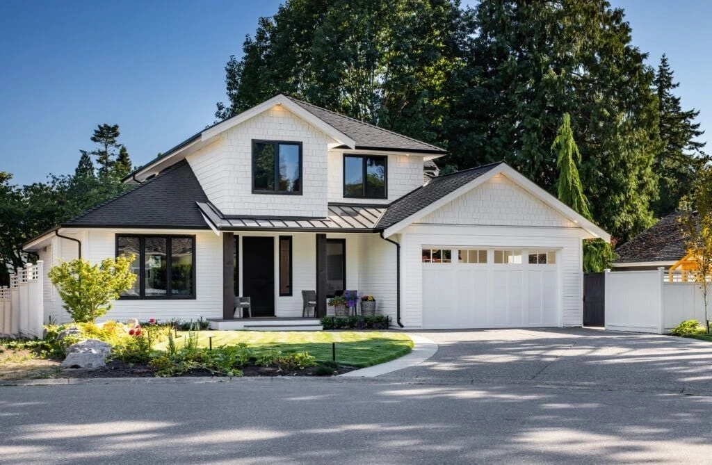 Completed two-storey white home with landscaped front garden